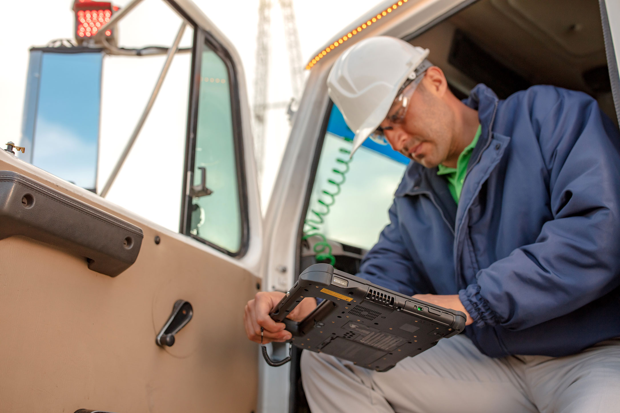 Nuffield software development on a Zebra rugged tablet used by an electrical worker getting out of a truck