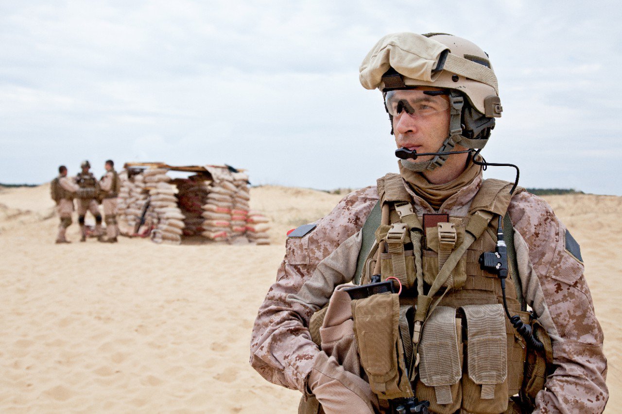 Soldier wearing helmet in a desert