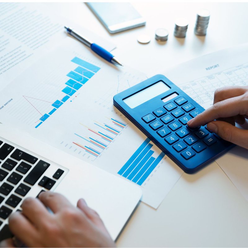 Person using a calculator for budget calculations